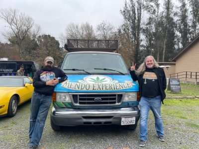 Tour guides flanking weed tour art car
